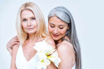 beauty image with two women with different age, skin and body