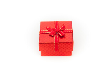 red gift box with ribbon on white