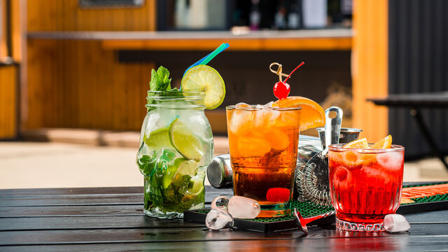 Set of coctails on bar counter in a restaurant, pub. Collection of fresh juice alcoholic drinks