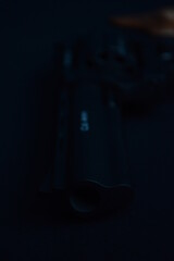 a flobert revolver on the black background