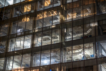 Remodelling a Modern office building at night	
