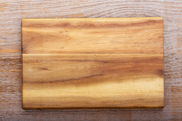 Chopping kitchen boards on a wooden background. Top view flat lay.