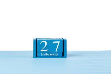 Wooden calendar February 27 on a white background