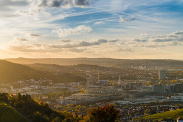 Germany, Stuttgart city panorama landscape view above industrial quarter and mountains, houses,...