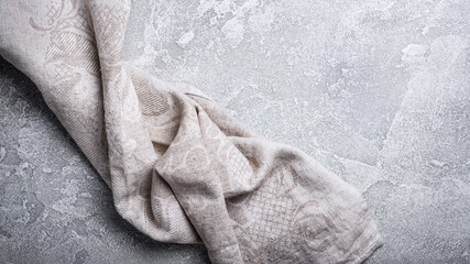 Linen napkin on grey concrete background