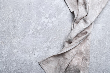 Linen napkin on grey concrete background