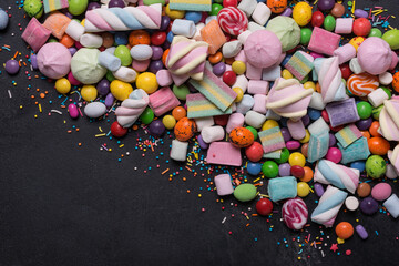 Bright sweet multicolored dragee, candies, lollipops, marshmallows