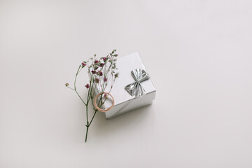 Beautiful box with engagement ring on white background