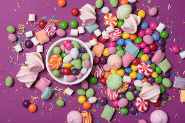 Bright sweet multicolored dragee, candies, lollipops, marshmallows