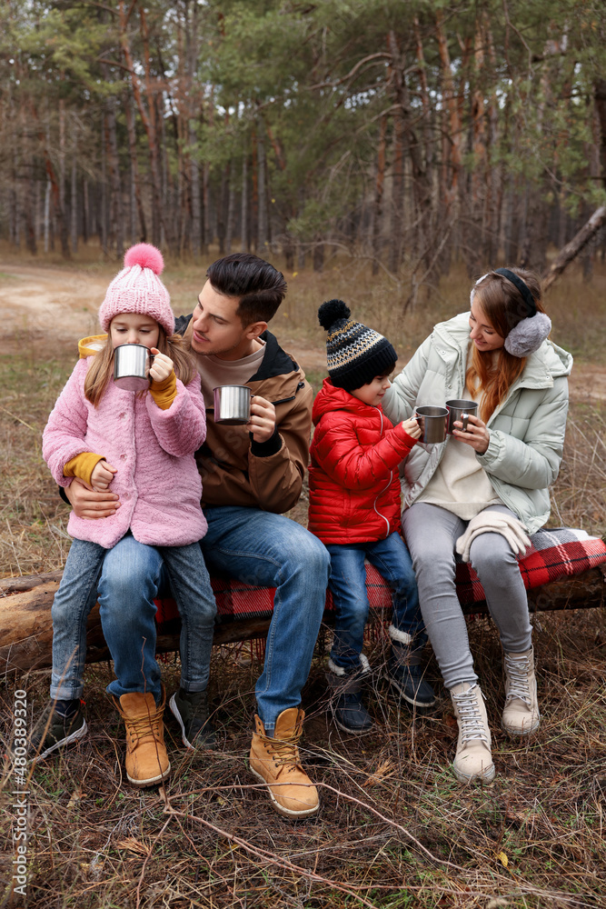 Canvas Prints Happy family with cups of hot tea spending time together in forest