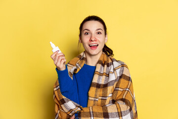 Portrait of Caucasian young woman flu and cold, feeling sick posing isolated on yellow studio background.