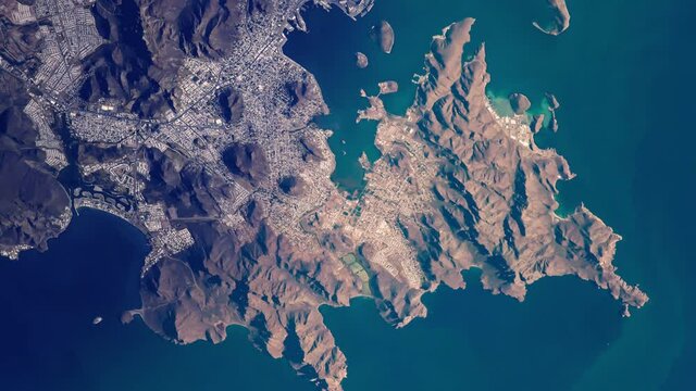Mexico coast line mountains and city of Guaymas on gulf of California, sunrise animation aerial satellite view from space. Based on image by Nasa