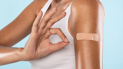 Vaccinated Lady Showing Ok Gesture After Getting Vaccine