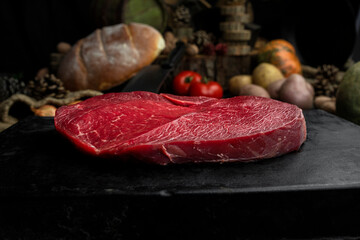 Raw beef steak in the rustic kitchen