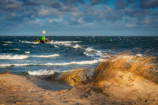 Windy day at wintery beach by the Baltic Sea in Gdansk. Poland
