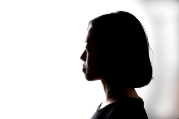 Silhouette dark black portraits of young southeast Asian woman on white background romance love care friends emotion expression thoughts