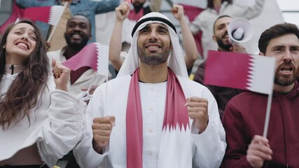 Muslim man gesturing and shouting during soccer game