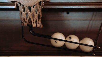 The billiard ball falls into the hole. A full hole clogged billiard balls. Slow motion. Billiard sport concept