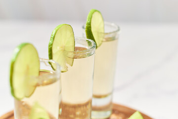 Close up of shots of traditional tequila. Mexican alcoholic drink.