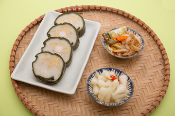 Vietnamese food for Tet holiday in spring, it is traditional food on lunar new year: Cylindric glutinous rice cake, dried shrimp, pickled small leeks,