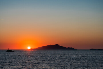 Naklejka premium Ischia Island Orange Sunset in Italy in the Tyrrhenian Sea