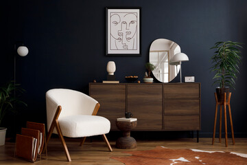 Stylish compositon of elegant living room interior design with fluffy armchair, wooden commode, mock up poster frame and modern home accessories. Blue wall. Home staging. Template. Copy space.