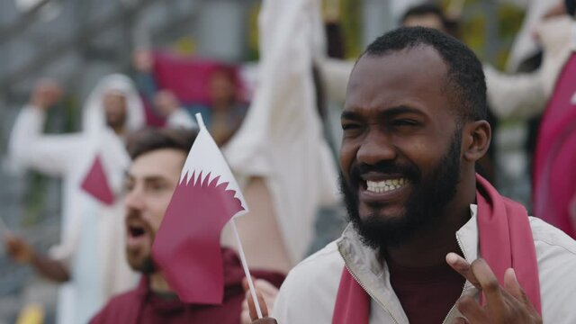 African american man emotionally watching soccer game