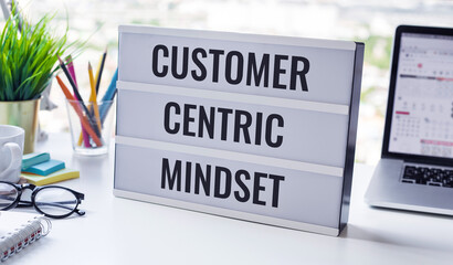 Customer centric mindset text with work table.business service - obrazy, fototapety, plakaty