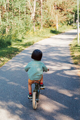 Boy lerning to ride a bike