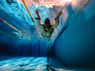 Man underwater in the pool 