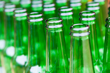 Lots of empty glass beer bottles.