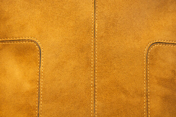 suede yellow bag. leather on a light background. leather goods concept