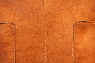 suede orange bag. leather on a light background. leather goods concept	