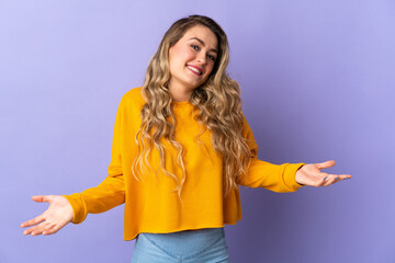 Young Brazilian woman isolated on purple background happy and smiling