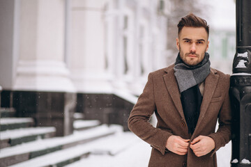 Handsome young business man outside in winter