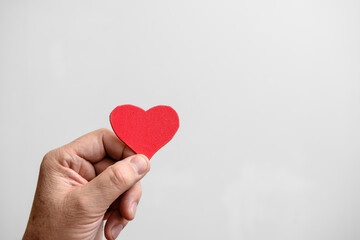 Valentine's Day background. Red hearts in your hand . Copy space.