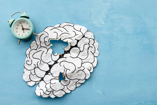  brain made of paper damaged by old age. Age-related changes and mental health. Signs of dementia and head disease.