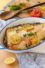 Salmon fillet baked with vegetables. Fish dish