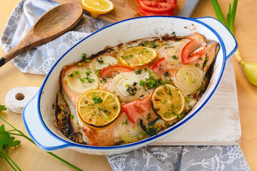 Salmon fillet baked with vegetables. Fish dish