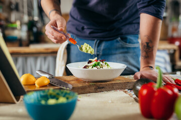 close up man preparing salad