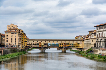 Ponte Vecchio, old bridge over Arno River on a cloudy day, Florence, Tuscany, Italy