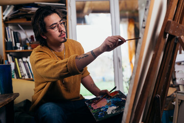 man painter working in his atelier