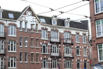 Fototapeta na wymiar Amsterdam Baarsjes District Street View with Brick Building Facade, Netherlands