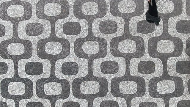 Top down aerial view of iconic Ipanema Beach mosaic sidewalk in Rio de Janeiro, Brazil.