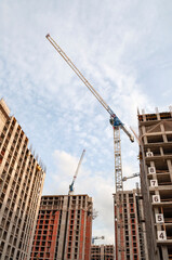 A crane on the construction of a high-rise building. Saint-Petersburg