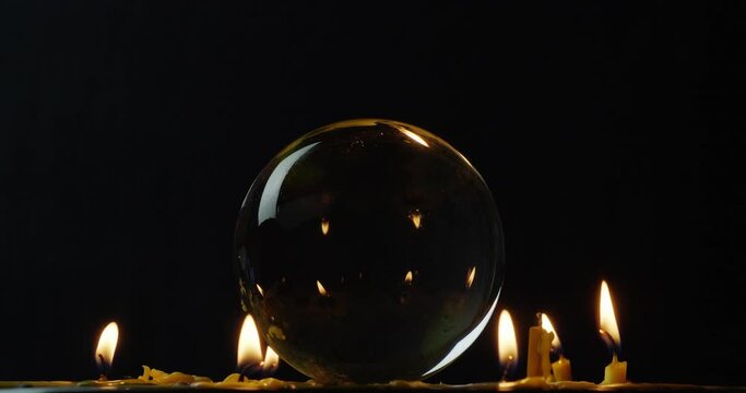Closeup shot of a candle light with crystal ball, Rotate
