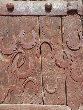 Horse shoe on a wooden old door built at the time of Mughal empire in Allahabad india
