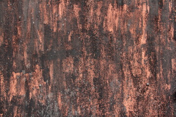 Old shabby design concept of rusty metal surface, black-brown texture of the layout dark background for creative wallpaper