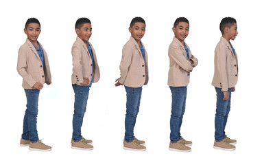 Obraz premium side view of same boy dressed in blazer on white background