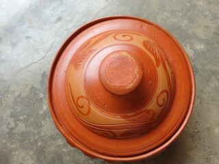 Top view of clay pot with lid on it                               